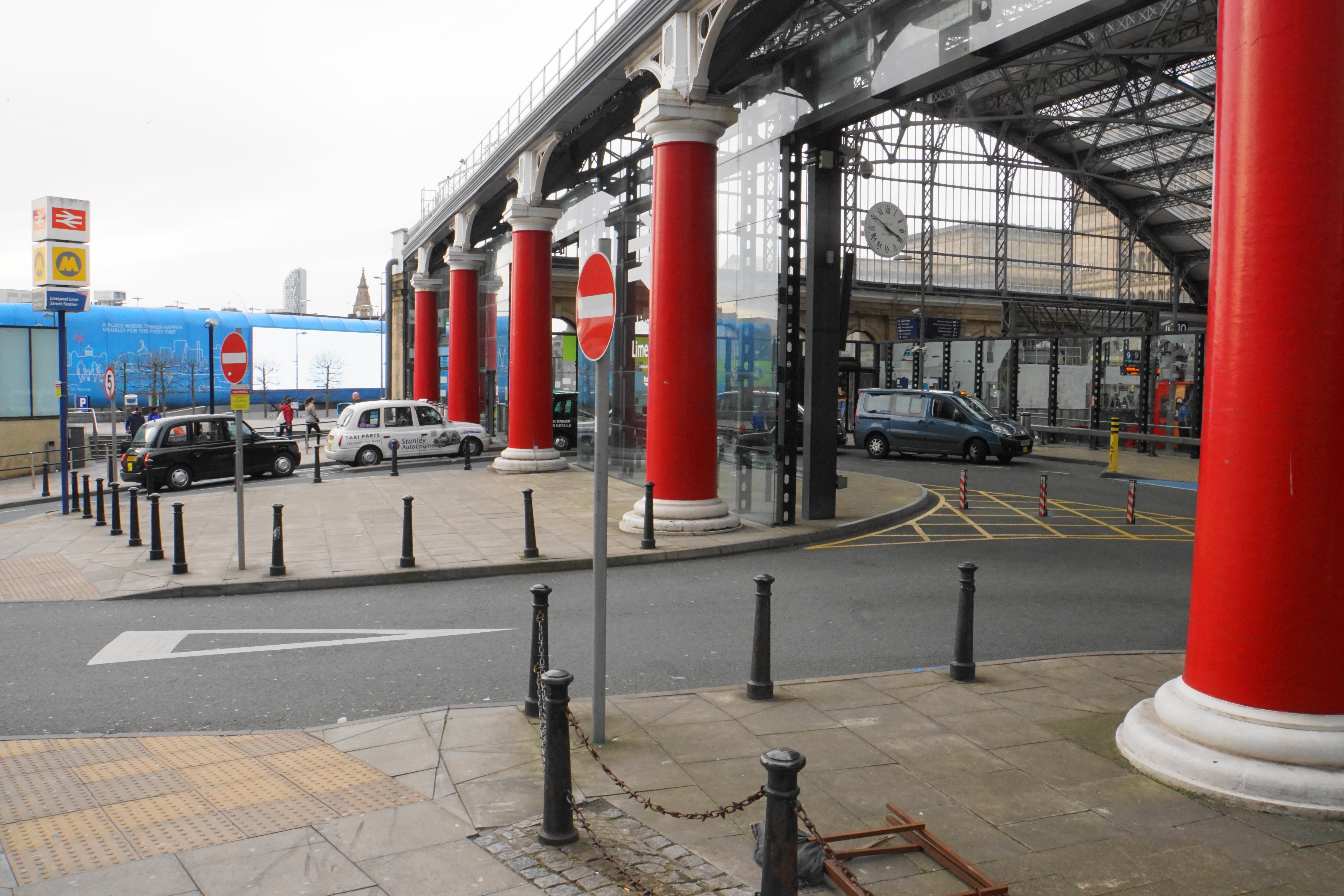 Taxi rank beside a railway station for ride-sharing and private hire pickups